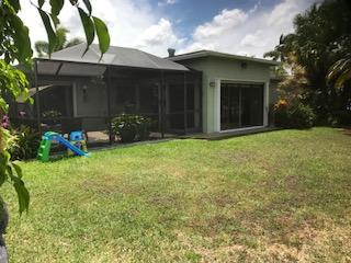 10907 Gable Street Boca Raton, FL 33428 - Photo 5 of 40 a view of a chair and table in backyard of the house