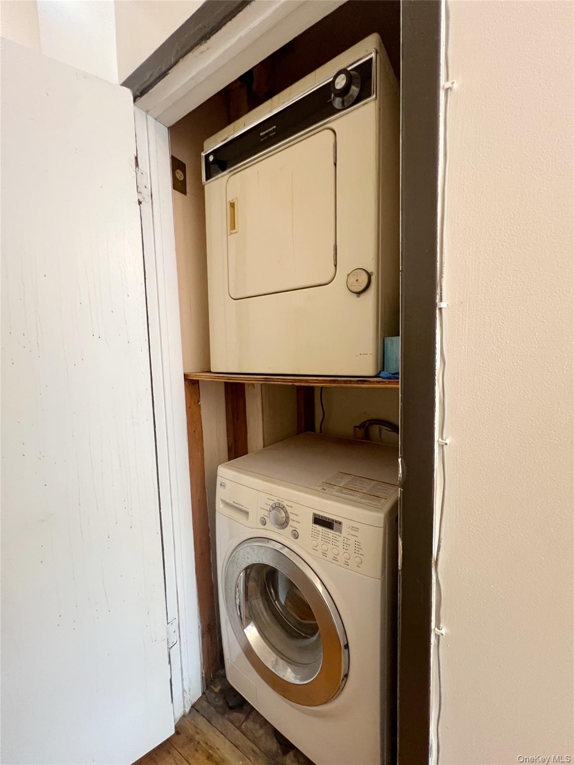 219-74 64th Avenue, Unit 239 Queens, NY 11364 - Photo 9 of 12 a utility room with dryer and washer