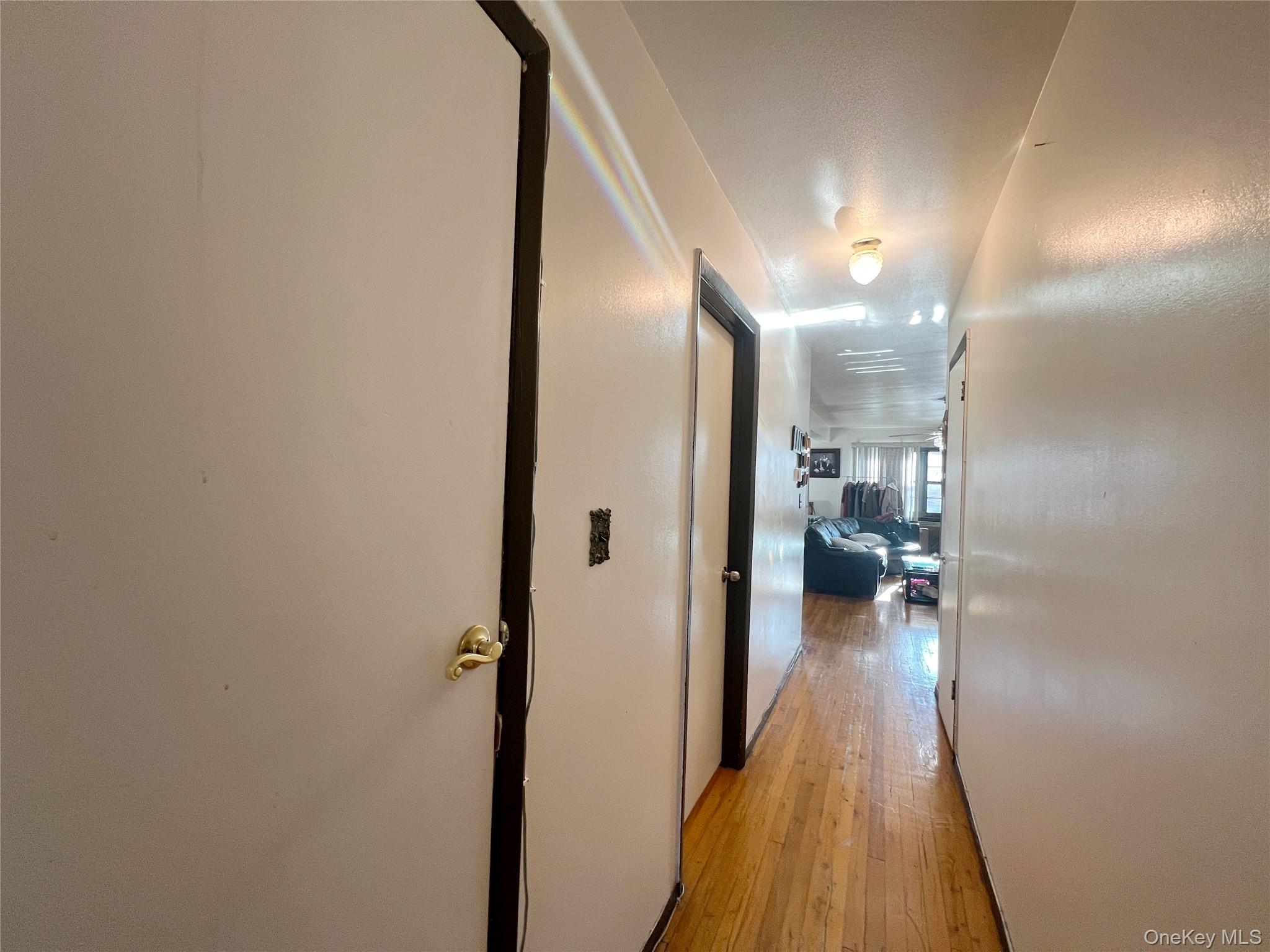219-74 64th Avenue, Unit 239 Queens, NY 11364 - Photo 10 of 12 a view of a hallway view with living room