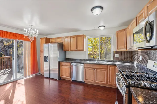 a view of a livingroom with furniture window and wooden floor