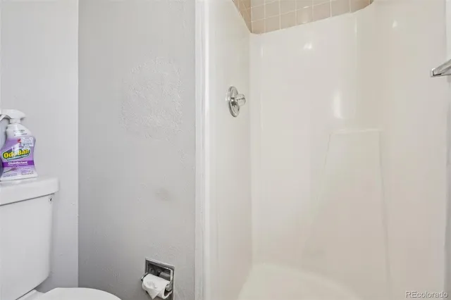 a bedroom with a bed and dresser