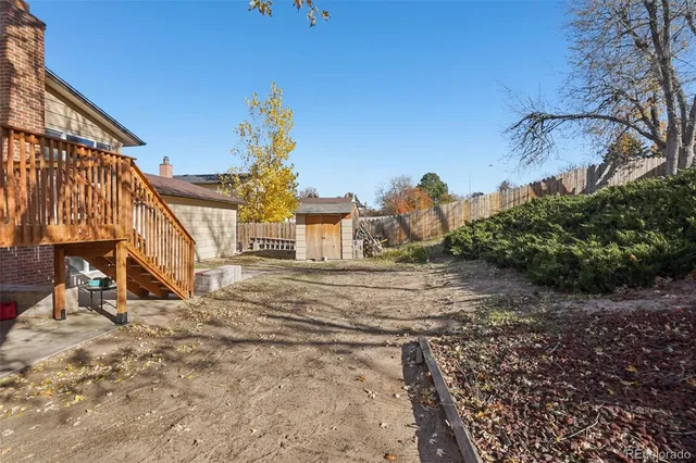 a view of a house with a snow in the yard