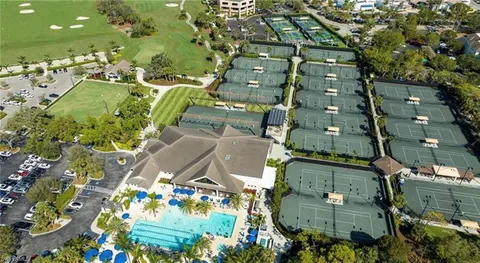 an aerial view of a residential houses with outdoor space