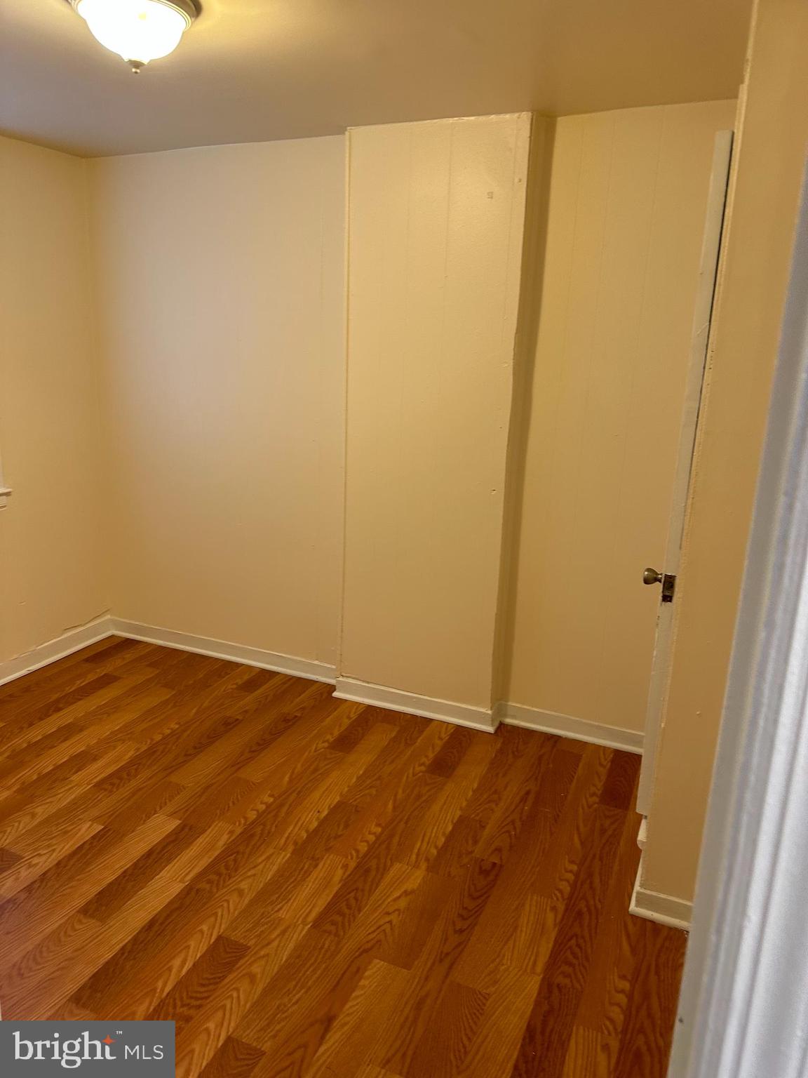 401 Maple Lane Dundalk, MD 21222 - Photo 4 of 15 a view of empty room with wooden floor