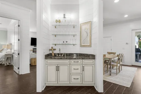 a kitchen with stainless steel appliances granite countertop white cabinets sink and dishwasher