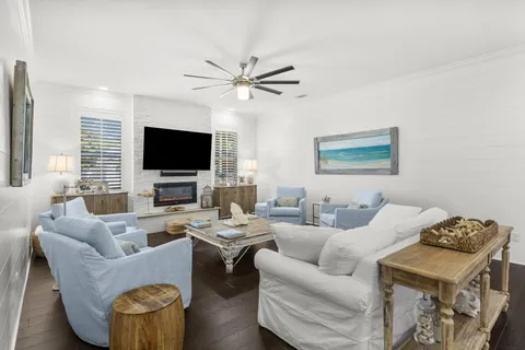 a bedroom with a bed and a flat tv screen on dresser