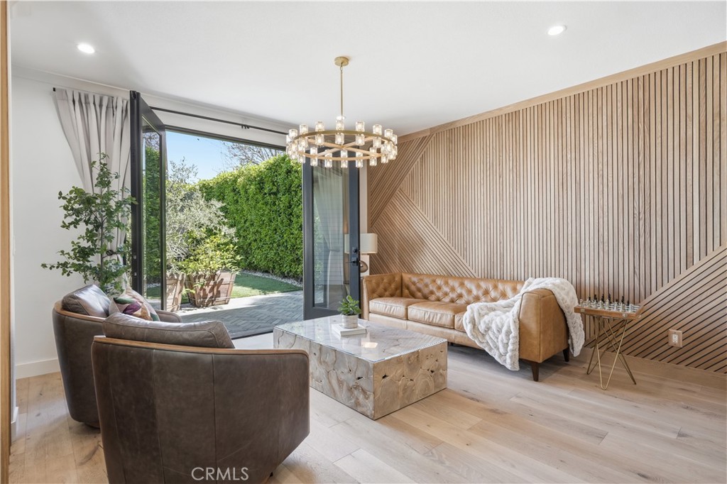 1852 6th Street Manhattan Beach, CA 90266 - Photo 27 of 58 Oak slat accent wall and lush ficus hedges create effortlessly elegant backdrop.