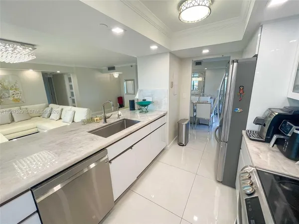 a bathroom with a sink a toilet a mirror and vanity