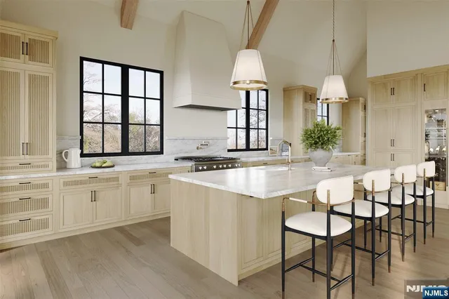 a kitchen with granite countertop white cabinets and a sink