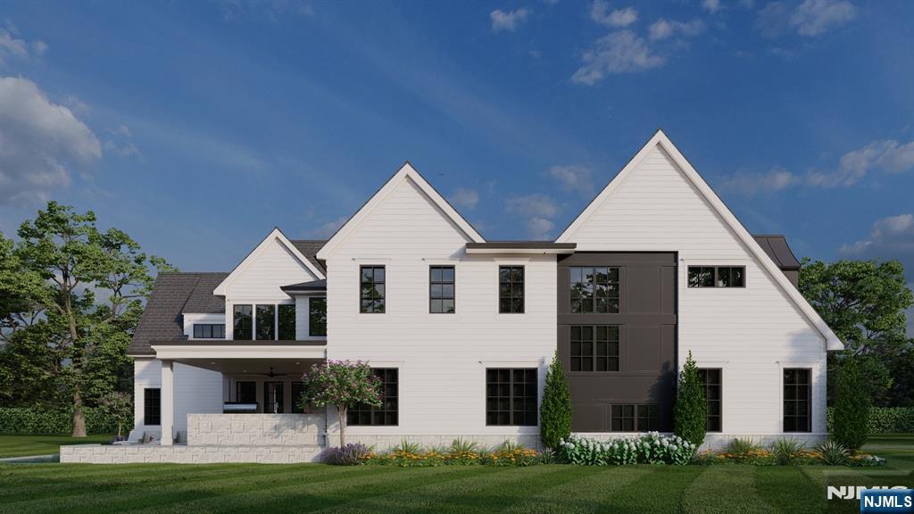 41 Orchard Road Demarest, NJ 07627 - Photo 15 of 17 a front view of a house with a yard