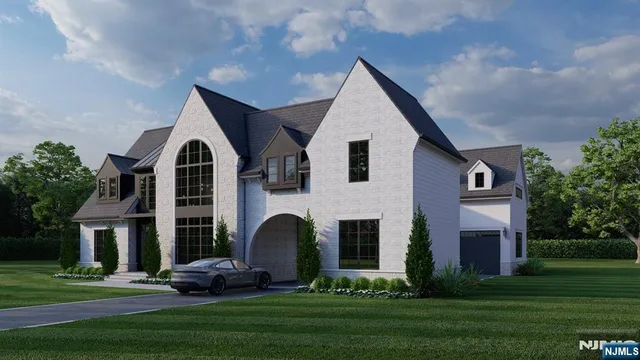 a front view of house with a garden