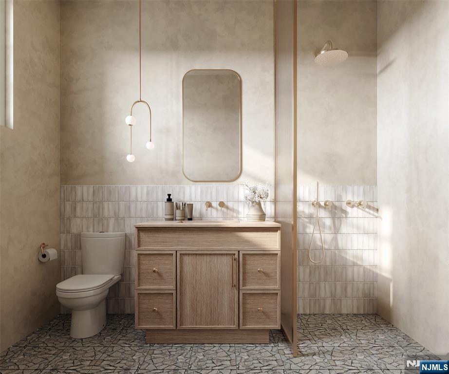 41 Orchard Road Demarest, NJ 07627 - Photo 5 of 17 a bathroom with a toilet sink and mirror