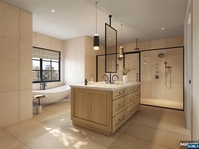 a bathroom with a double vanity sink a large mirror and a bathtub