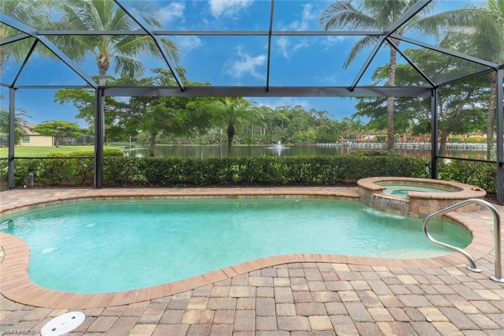 9458 Piacere Way Naples, FL 34113 - Photo 1 of 50 a view of a swimming pool with a patio