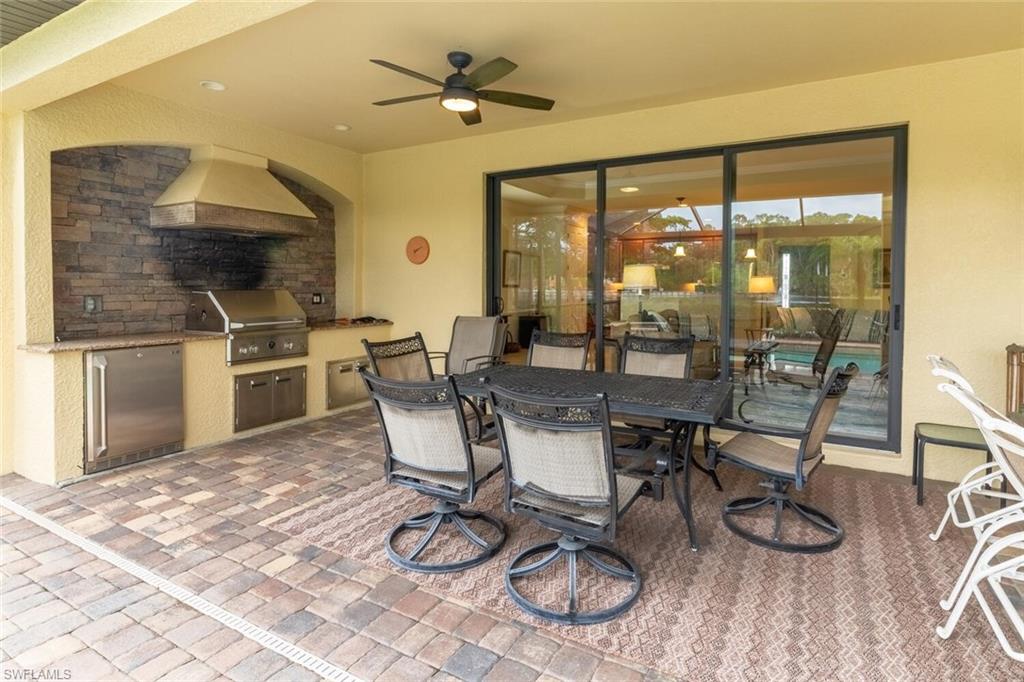 9458 Piacere Way Naples, FL 34113 - Photo 33 of 50 a view of a dining room with furniture window and outside view