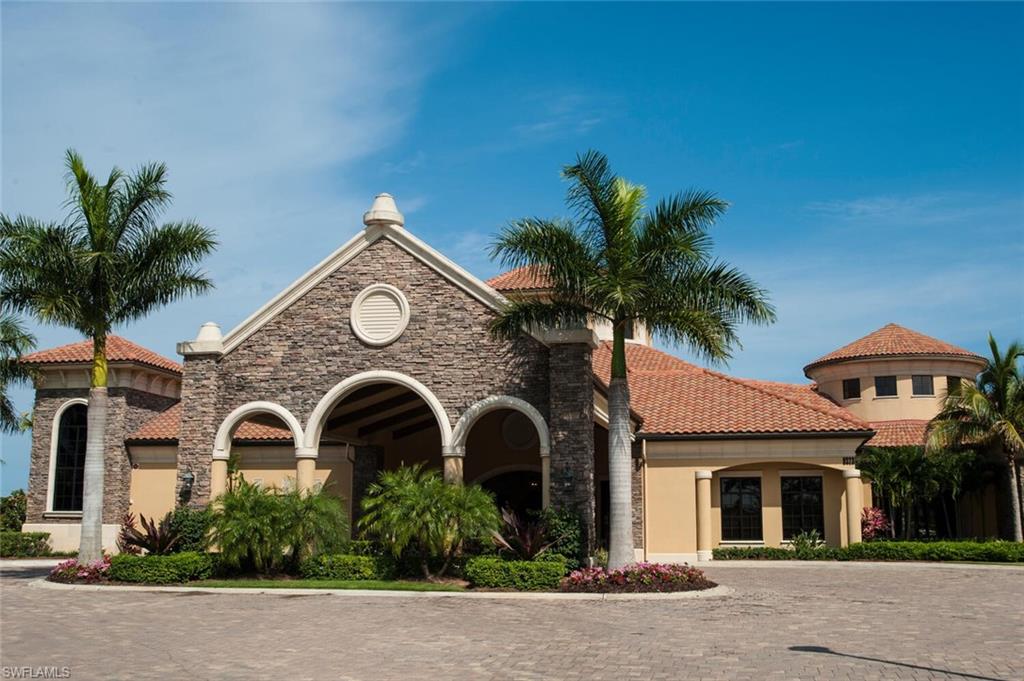 9458 Piacere Way Naples, FL 34113 - Photo 41 of 50 a front view of a house with a garden
