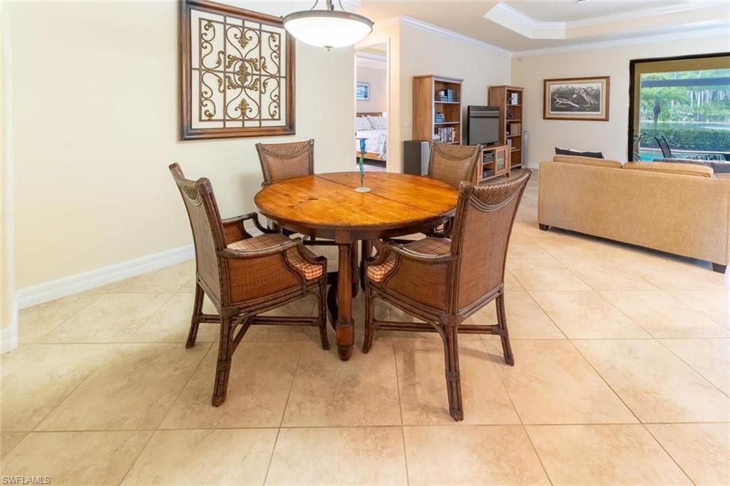 9458 Piacere Way Naples, FL 34113 - Photo 9 of 50 a dining room with furniture and window