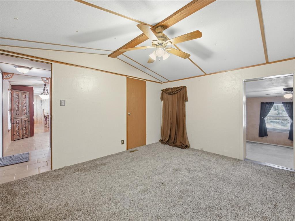 196 Perch Road Bowie, TX 76230 - Photo 10 of 33 en empty room with fan and entryway