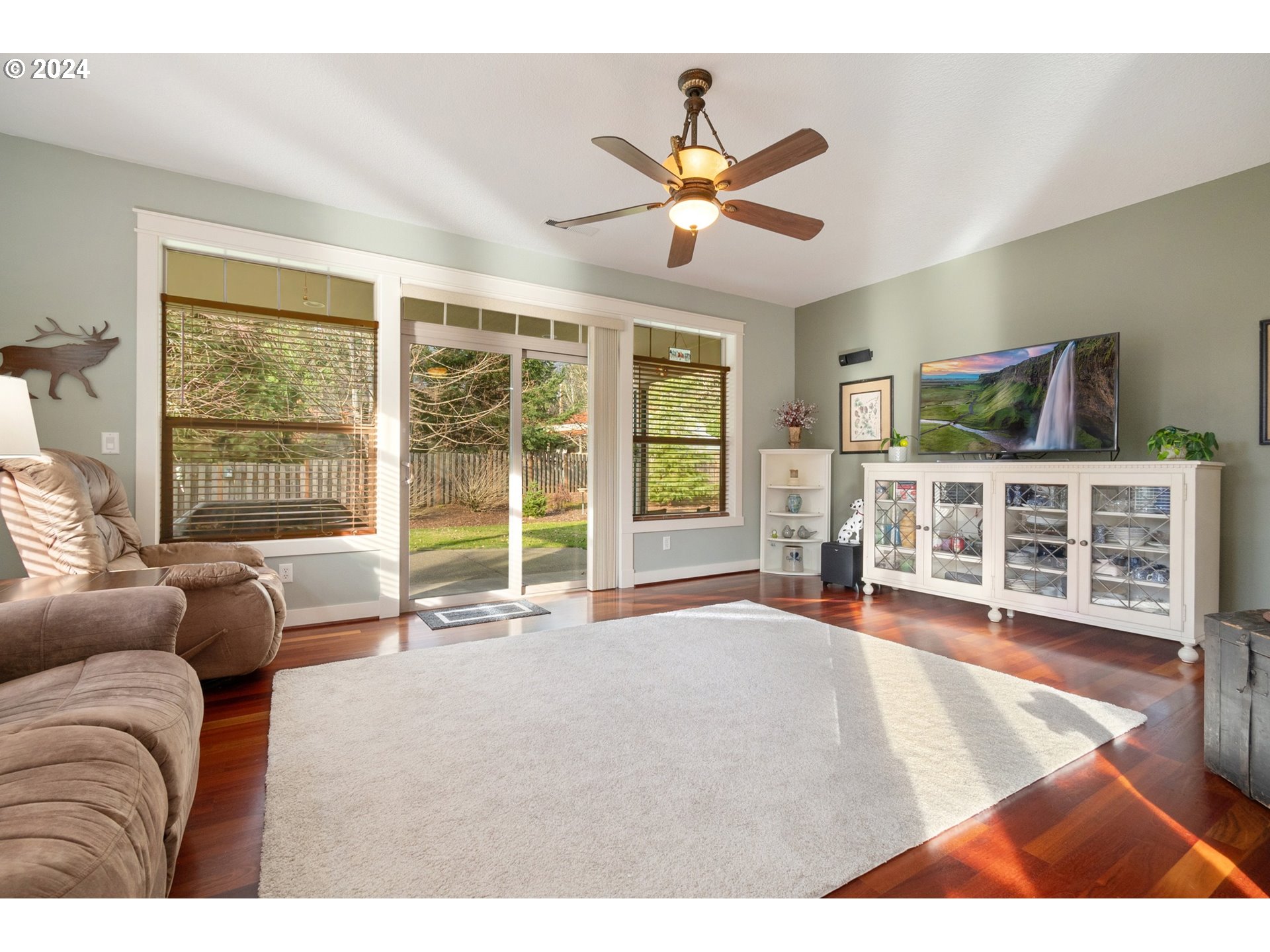 941 Northwest Angel Heights Road Stevenson, WA 98648 - Photo 14 of 38 a living room with furniture a flat screen tv and a large window