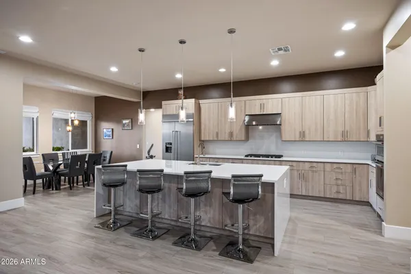 a view of a workspace with furniture and wooden floor