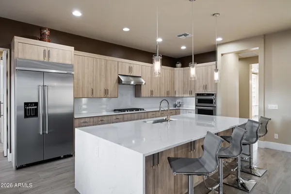a kitchen with lots of counter top space and furniture