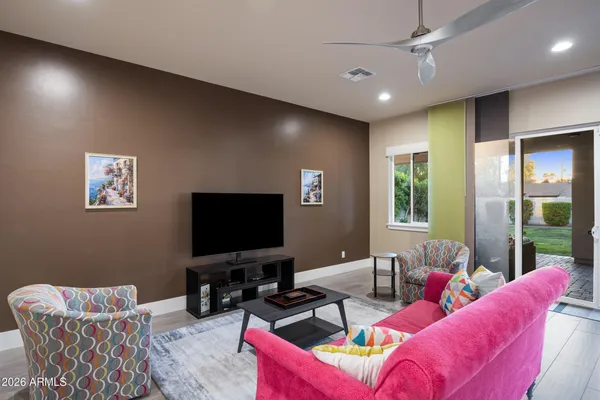 a living room with furniture and a flat screen tv