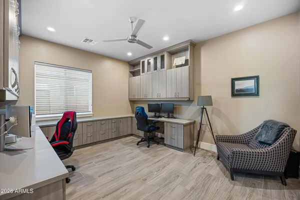 a view of a workspace with furniture and a kitchen