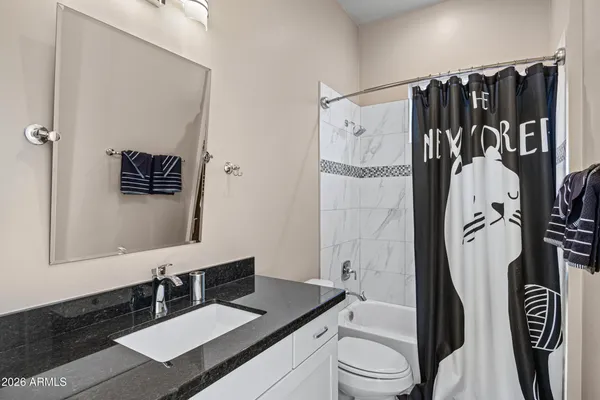 a bedroom with bed and window