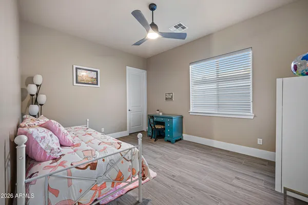 a bathroom with a double vanity sink toilet and shower