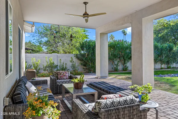 a view of a house with a swimming pool and a yard