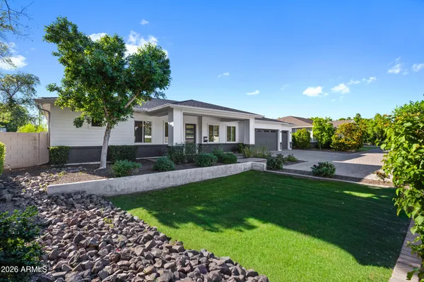 a view of a house with swimming pool and porch
