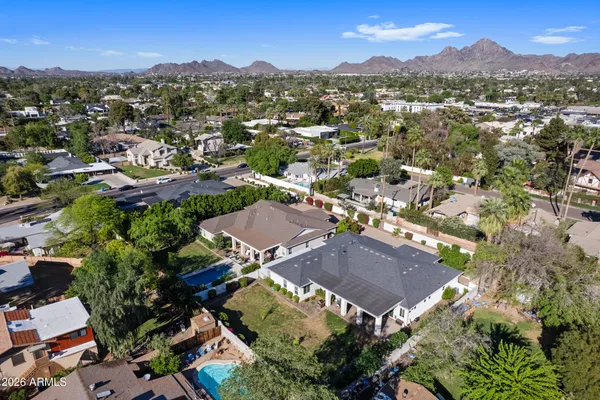 an aerial view of residential houses with outdoor space