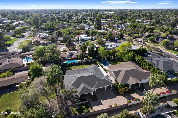 an aerial view of residential houses with outdoor space
