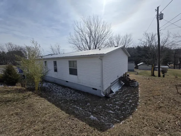 a backyard of a house with lots of green space