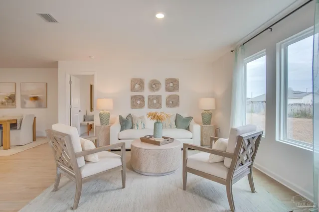 a living room with furniture and a table