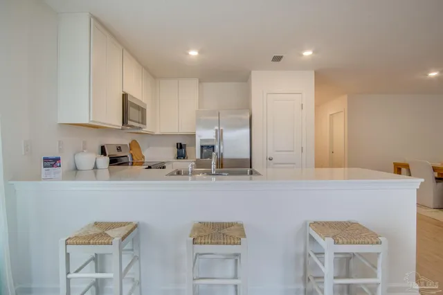 a bed room with a bed and a dresser