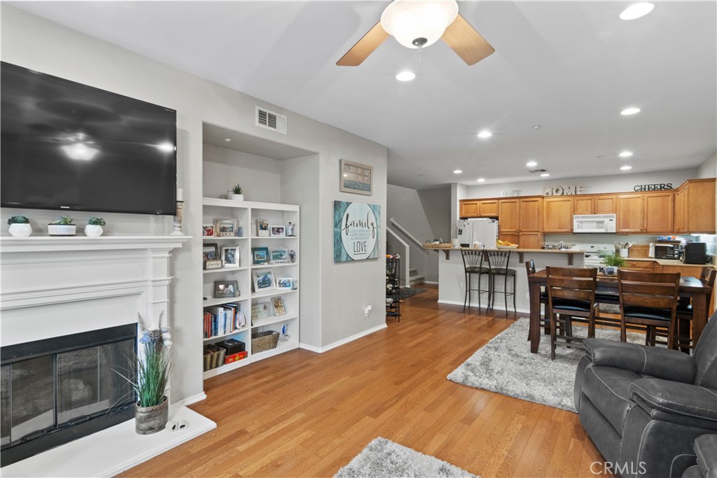 75 Reunion Irvine, CA 92603 - Photo 1 of 1 a living room with furniture a flat screen tv and a fireplace