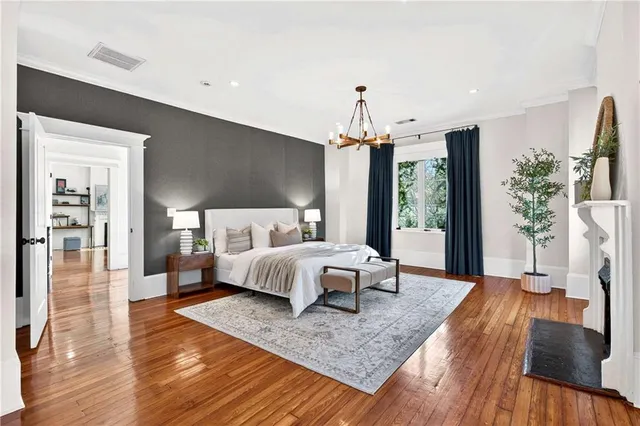 a bedroom with a bed and a fireplace