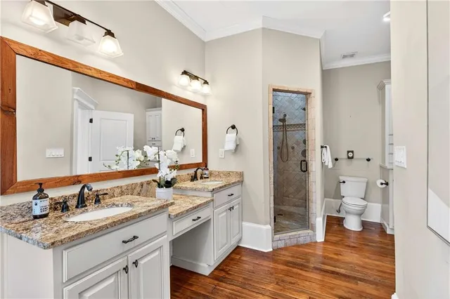 a view of hallway with wooden floor
