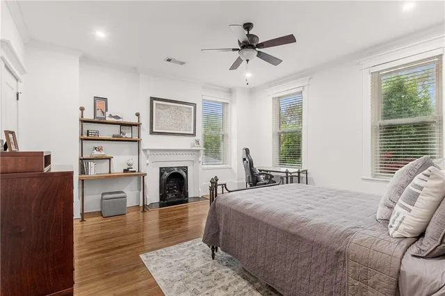 a spacious bedroom with a bed a window and closet