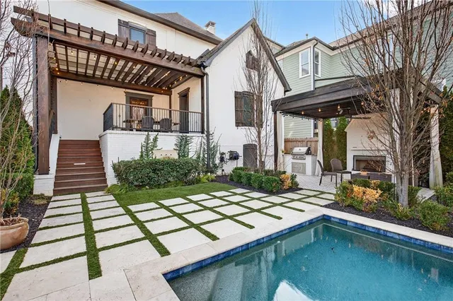 a view of a patio with couches chairs and a fire pit