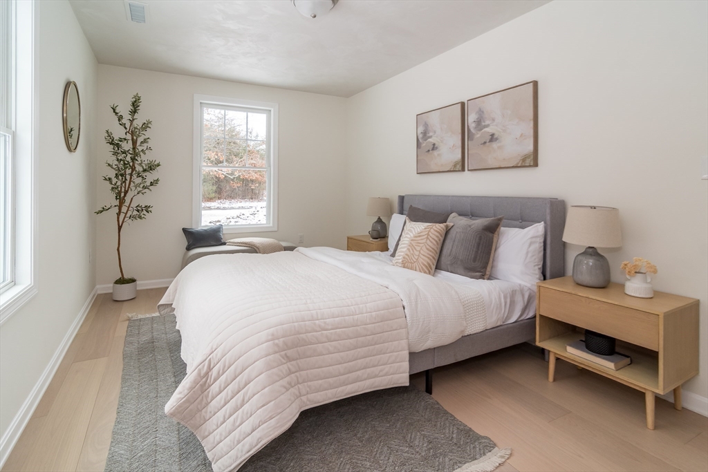 5 Launcher Way Wayland, MA 01778 - Photo 14 of 17 a bedroom with a bed and a window