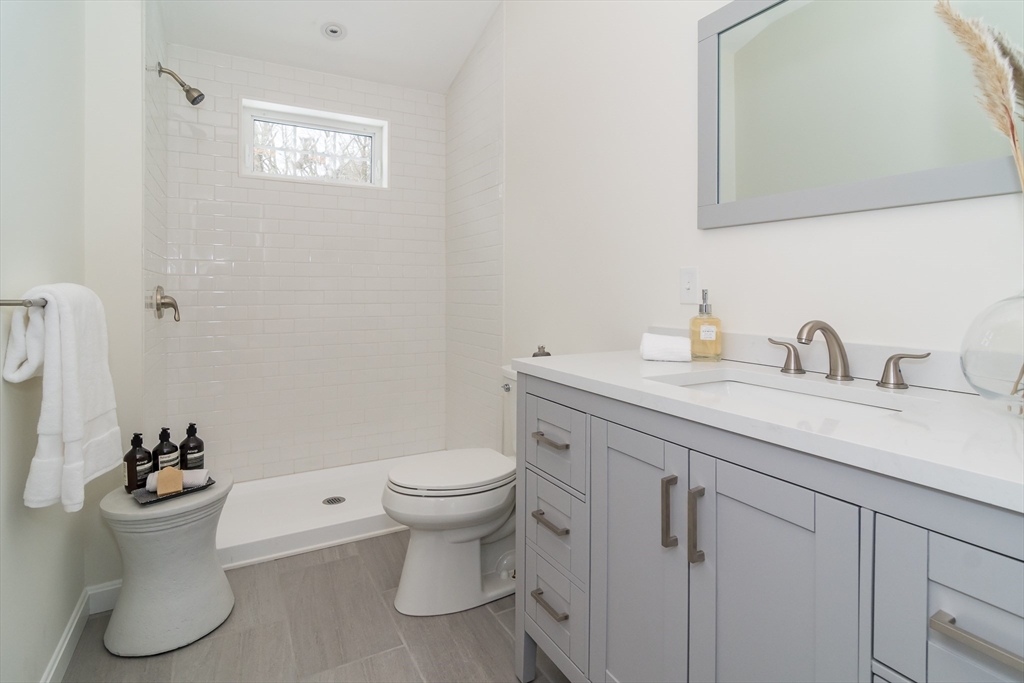 5 Launcher Way Wayland, MA 01778 - Photo 16 of 17 a bathroom with a sink toilet and a mirror
