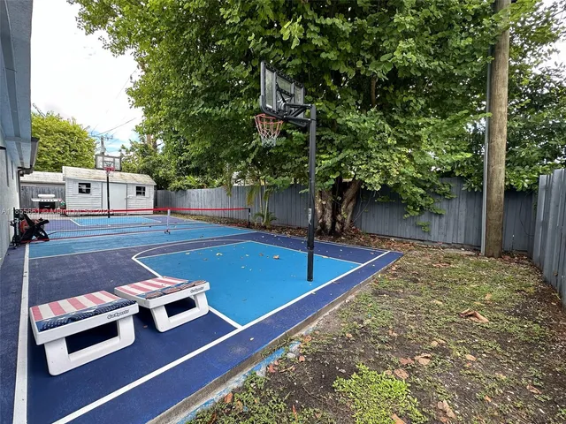 a view of a backyard with chairs