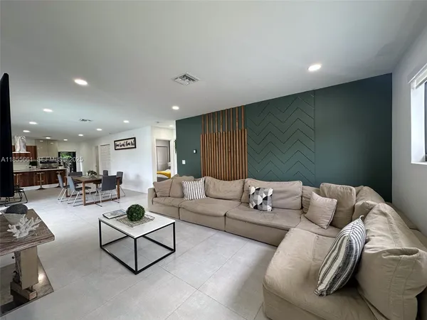 a living room with furniture and a couch