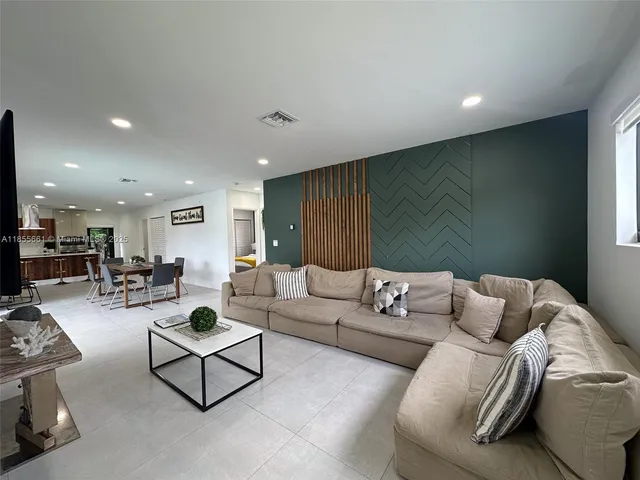 a living room with furniture and a couch