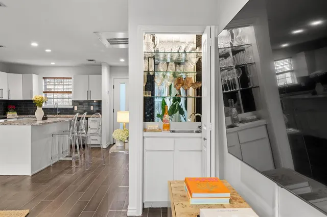a kitchen with stainless steel appliances a refrigerator and a stove top oven