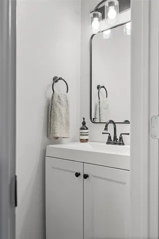 a bathroom with a sink and vanity