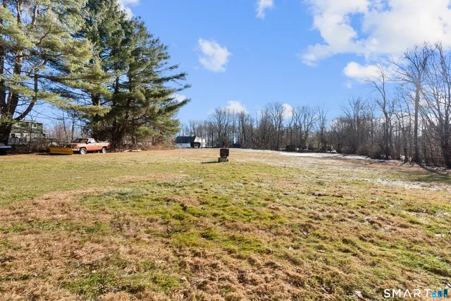 a view of outdoor space with trees all around