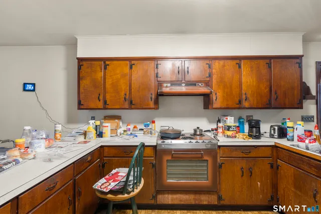 a kitchen with a sink cabinets and window
